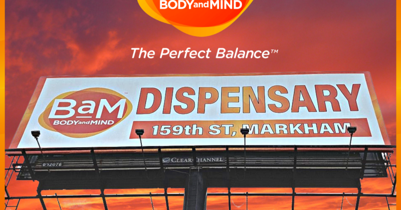 BaM Body and Mind billboard with bold branding and slogan against a vibrant sunset sky.
