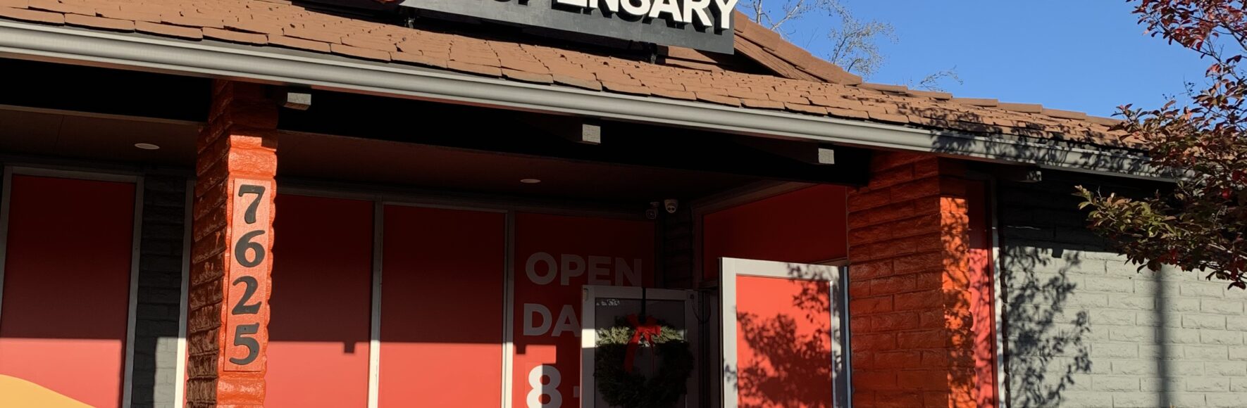 BaM Body and Mind storefront with bright orange accents and modern exterior design.